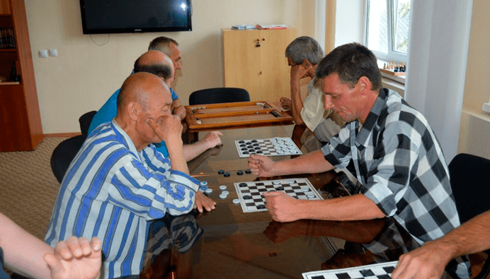 game of checkers to distract from the addiction to beer